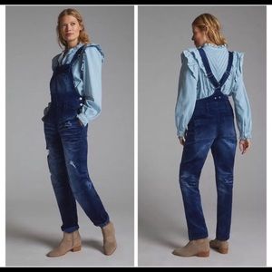 Pilcro blue velvet overalls with custom patches of standard rips
